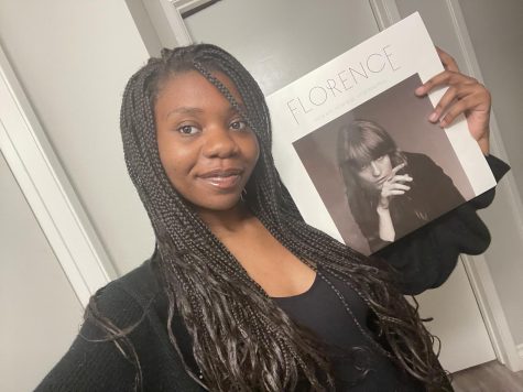 Rosemary Ché posing with her Florence Welch record. Photo courtesy of Ché.