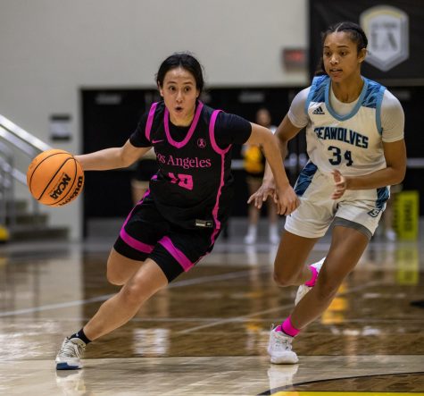 CSULA guard Ashley Orozco dribbles past Sonoma State guard Camille Johnson during the Golden Eagles 61-58 win at University Gym on Thursday, Feb. 23, 2023. Photo by Xavier Zamora.