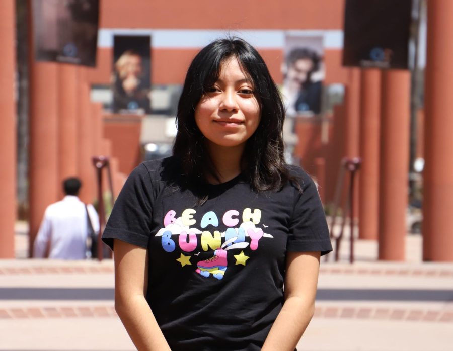 Ame Castillo poses for a photo on campus. Castillo said she feels isolated from her peers at times because she finds social situations overwhelming. Photo by Victoria Ivie.