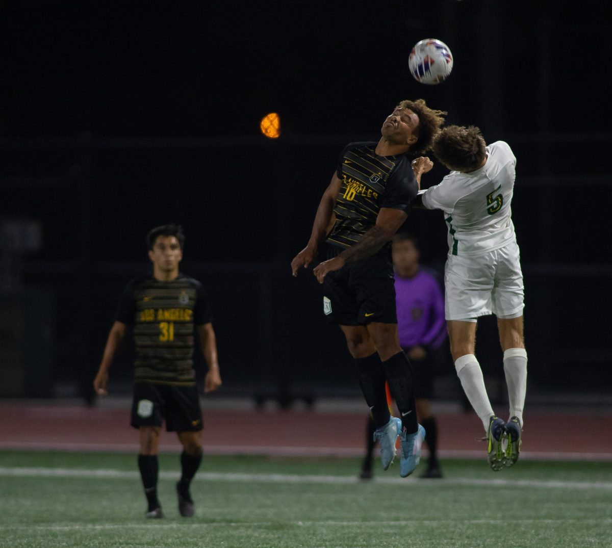 Jacob Chong goes up for a header during the Golden Eagles’ 3-1 win over Point Loma at University Stadium on Saturday, September 17, 2023.