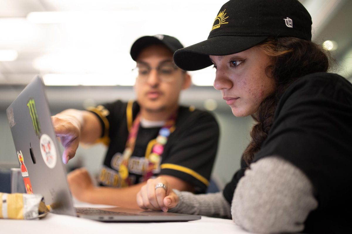 Incoming freshman and Criminology major Haley Garcia gets assistance in picking classes during the last new student orientation before the fall semester at the Golden Eagle Ballroom on Friday August 19, 2023.