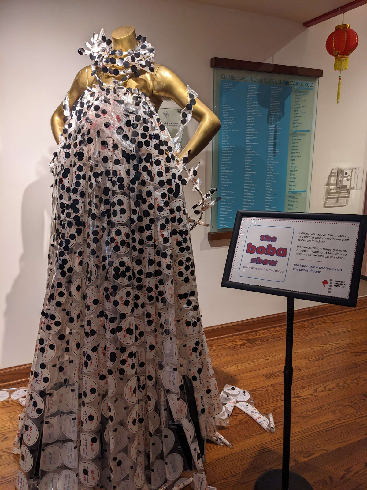 “Numa^ia to revive”, created by Roldy Aguera Ablao showing the dress covered in stickers from previous visitors of the exhibit.