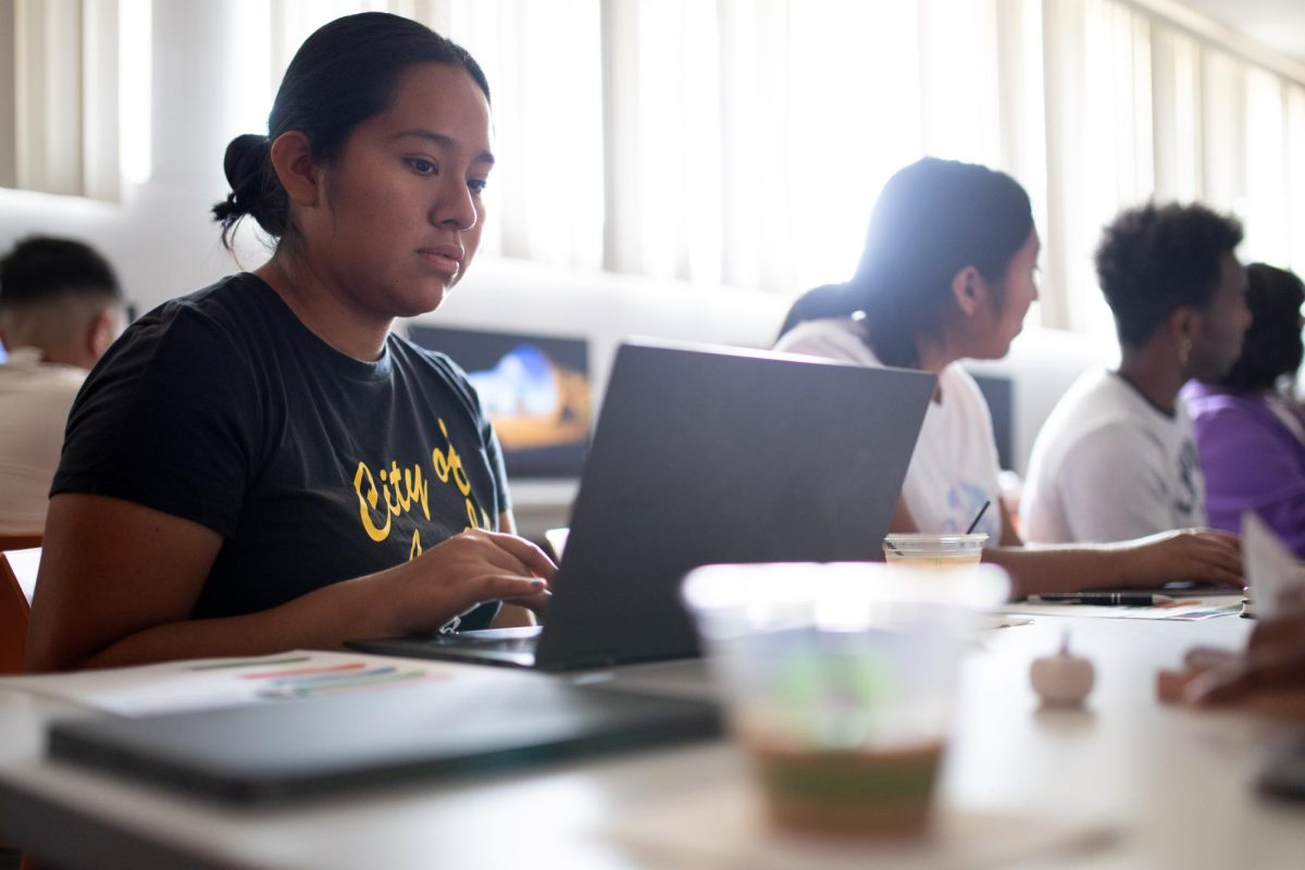 Gina Coronel works on her profile during a LinkedIn workshop at the Career Center on Thursday, Sept. 21, 2023.