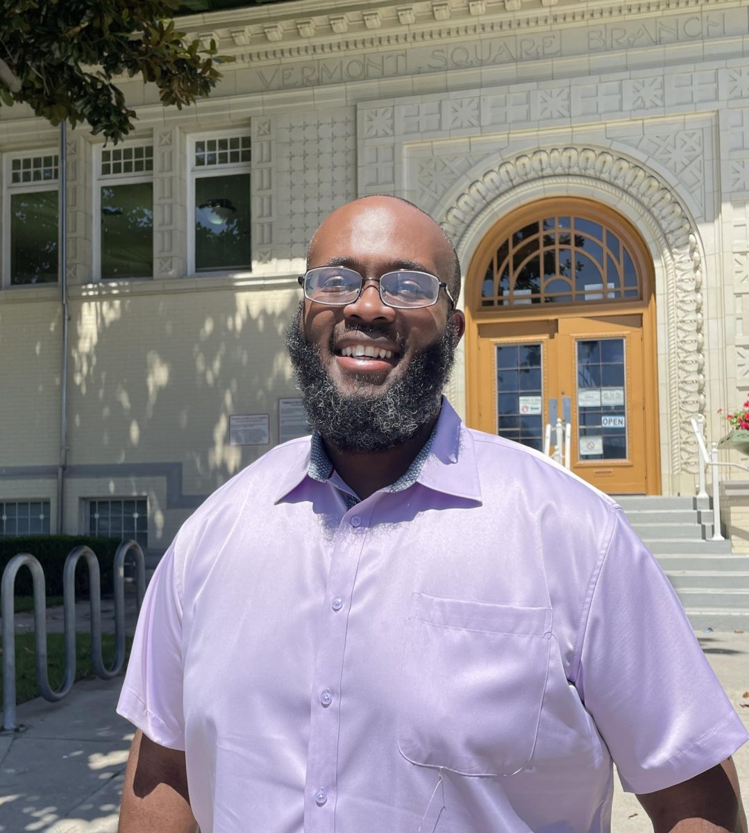 Matthew N. Crawford stands in front of the Vermont Square Public Library in Los Angeles, Calif. 