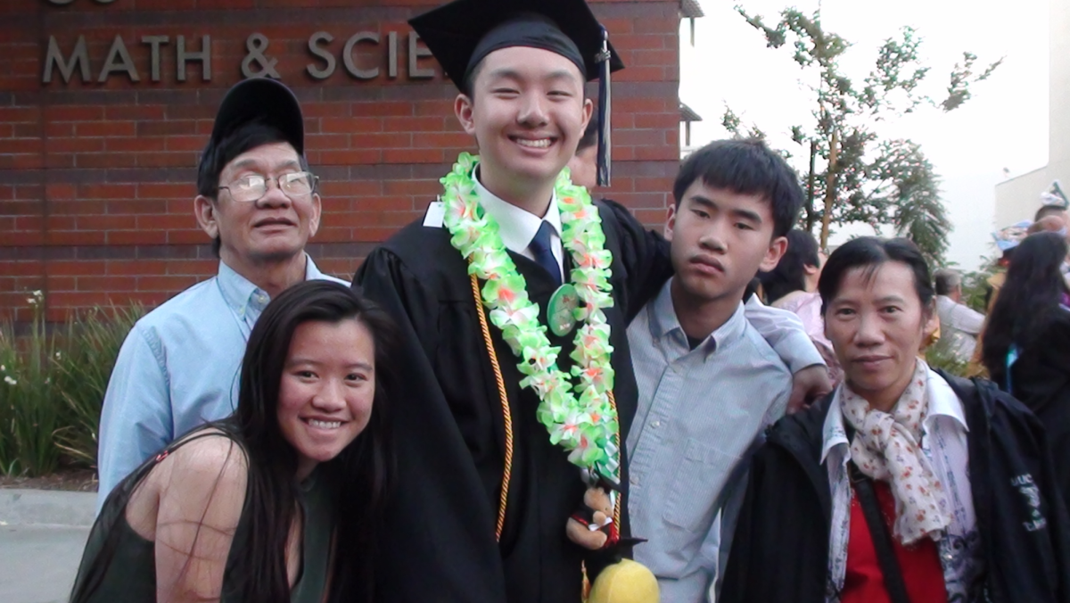 Brian Lai celebrating graduation with family.