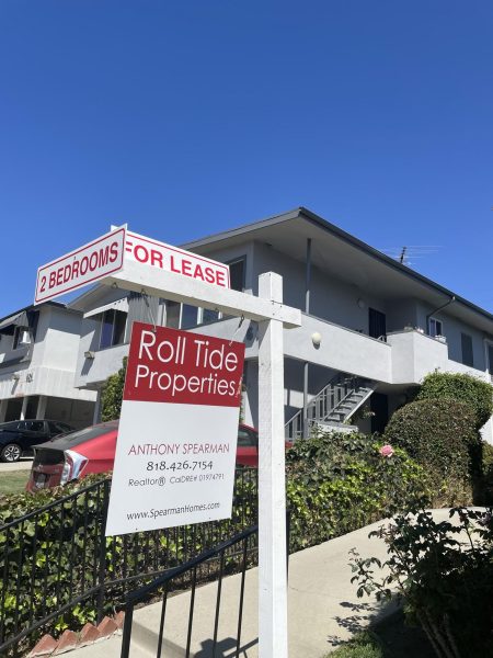 A "for lease" sign swings in the wind on Hayworth Avenue in Los Angeles. Photo by Lara Barney.