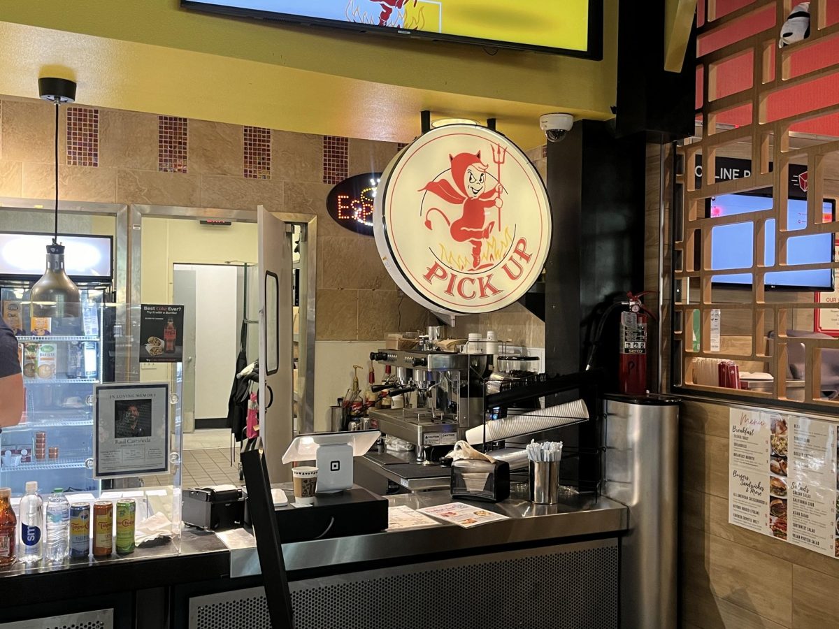 A sign in the food court sports the Diablo Grill logo. 