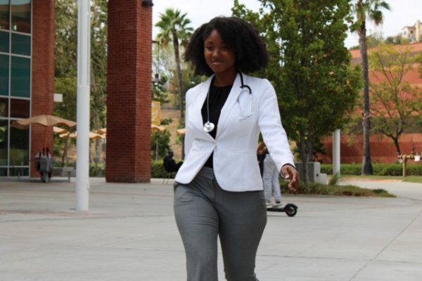 Nursing major model Alyse McIntosh, dressed for a nursing position interview, at the Interns Soar Career Fashion Show. 