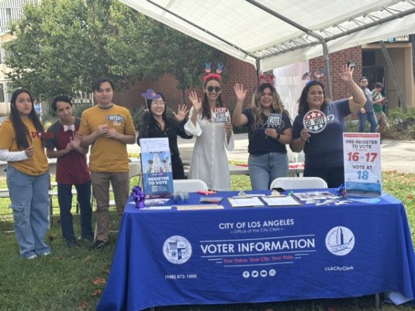 Volunteers from ASI and the County Clerk's office welcome students to the voter registration event. 