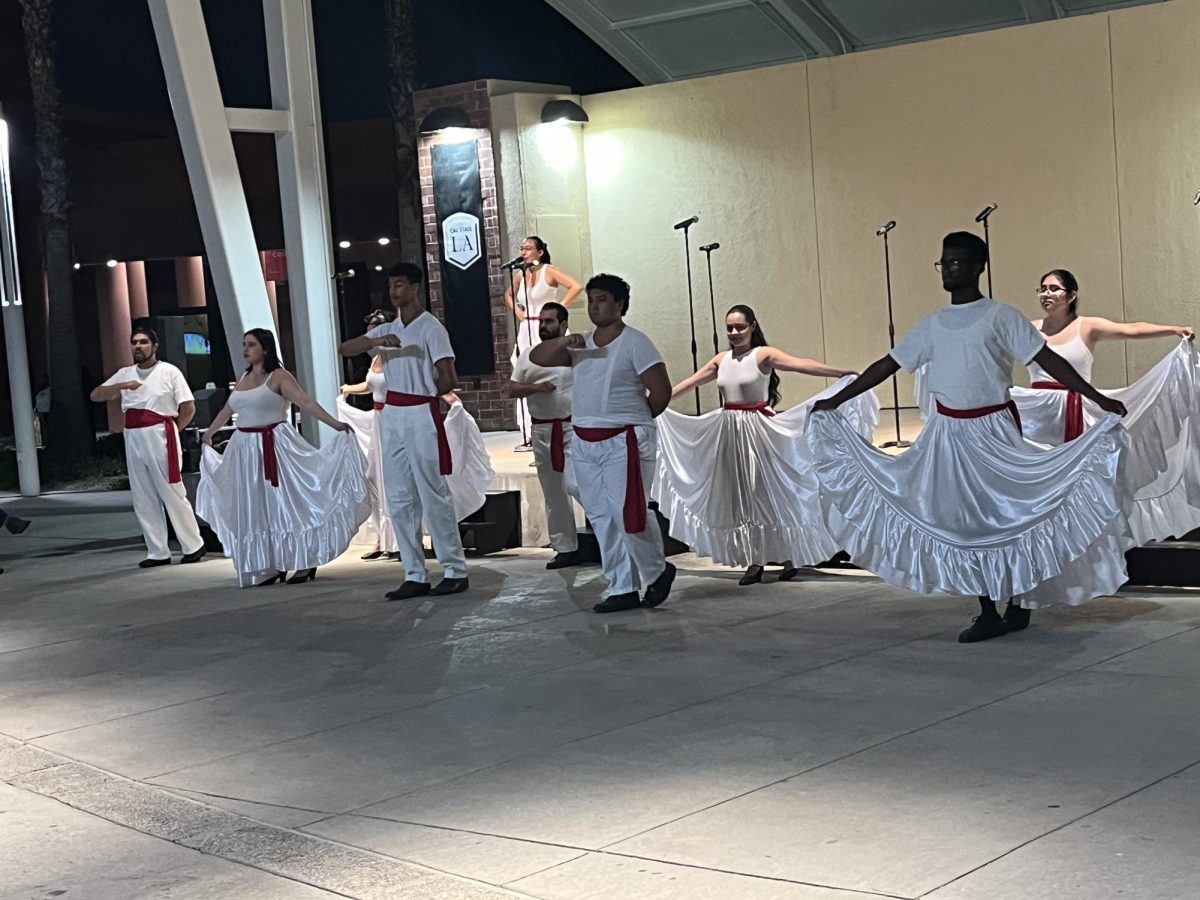 Dancers stand in formation during Thursday night's performance of “¡Celebramos!” on Oct. 3, 2024. Photo by Omar Ortiz.