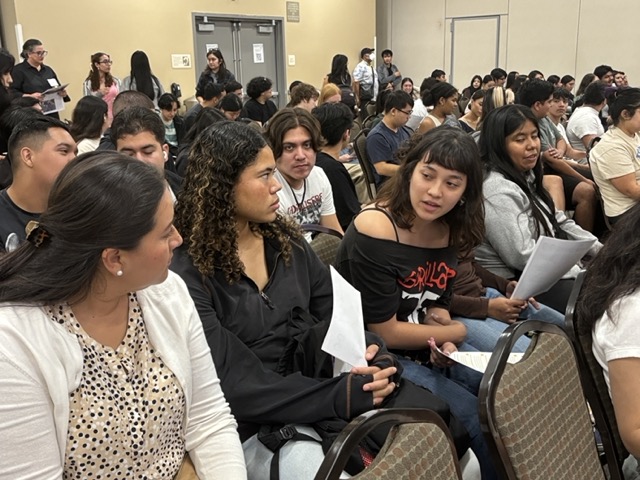 Attendees share their thoughts on state ballot propositions during "Breaking Down the Ballot: Burritos and Ballot Measures" on October 10, 2024.