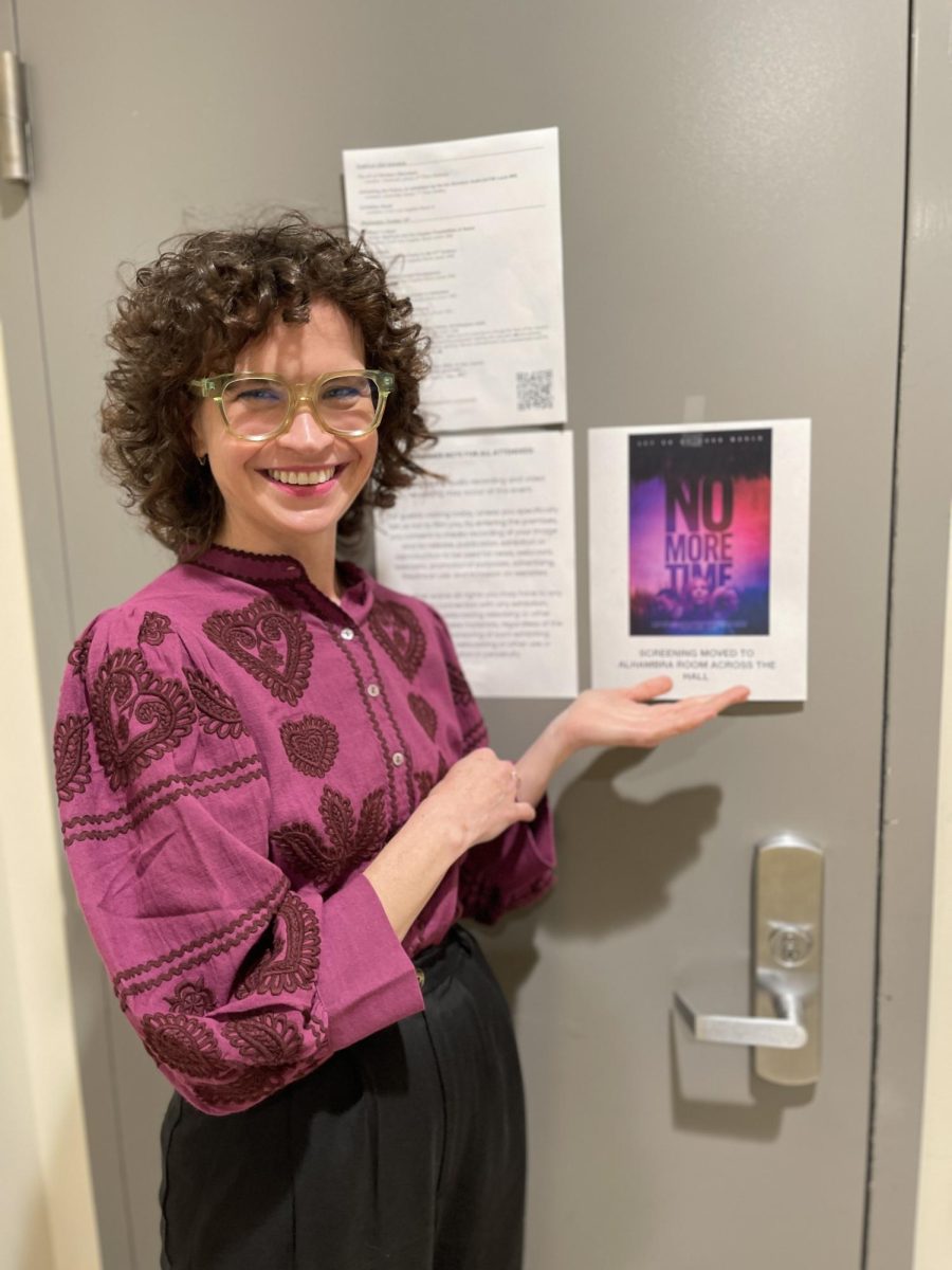 Dalila Droege poses with the poster of her newest feature length film "No More Time," which premiered at Eagle-Con on Oct. 16, 2024.