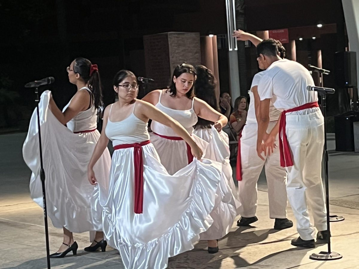 “¡Celebramos!” performers move to the beat of the drums during Thursday night's performance.