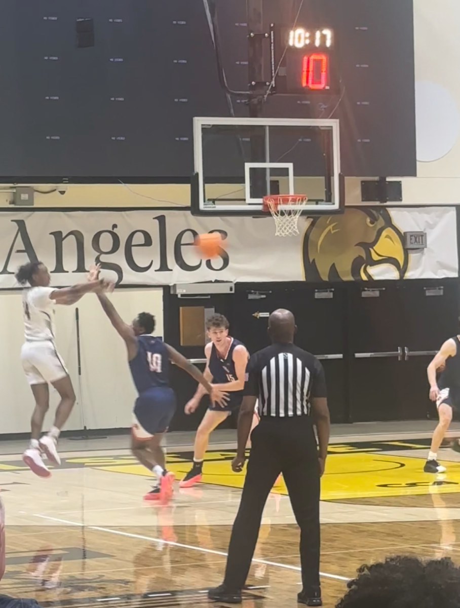 Cal State LA guard Shane Bell makes a jump pass to his teammate against Fresno Pacific on Wednesday, Nov. 13 at University Gym. The Golden Eagles won 86-59.