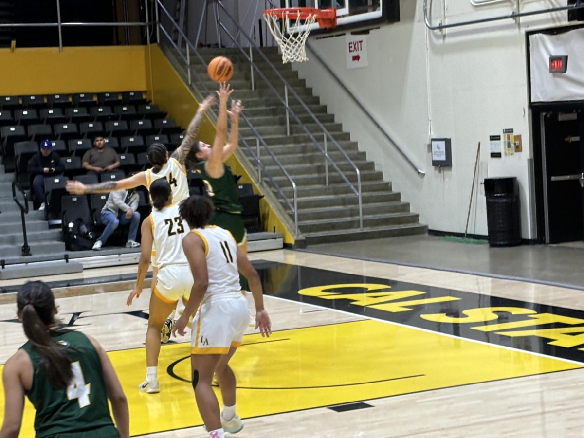 Nevaeh Asiasi (24) goes for a contest on a layup against a Concordia player during Cal State LA Women's basketball game versus Concordia on Nov. 20, 2024.