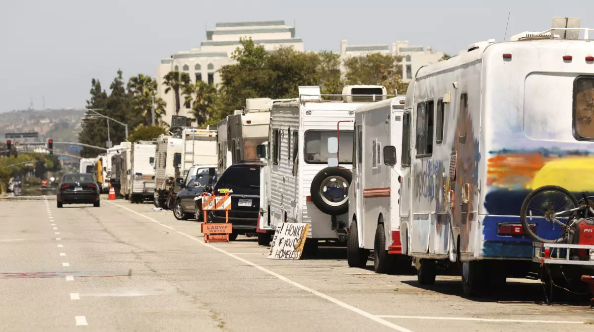 Rows of RVS are lined up along the street, reflecting the growing housing crisis. Photo by Halee Mosley.