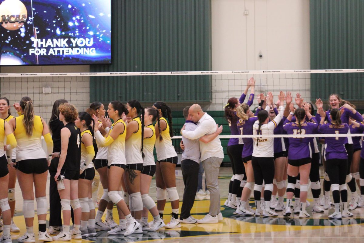 San Francisco State head coach Matt Hoffman (center left) and Cal State LA head coach Juan Figueroa (center right) hug after the game ends. The Gators defeated the Golden Eagles 3-2.