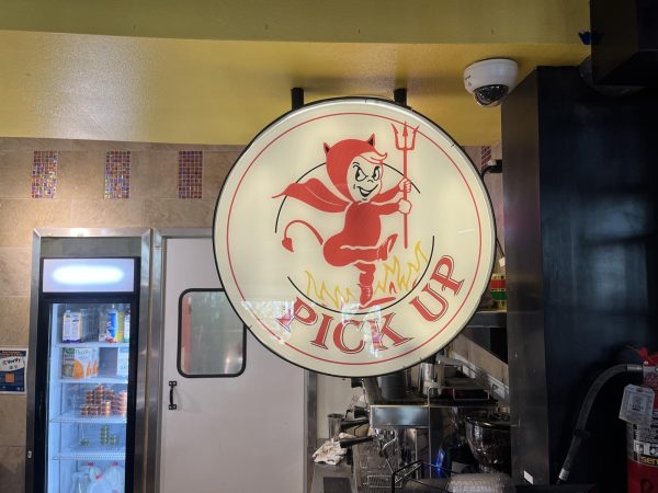 Black crewneck sweater featuring the diablo mascot this version of the mascot has the letter "S" on his costume a small difference compared to the Diablo Grills logo which lacks it.