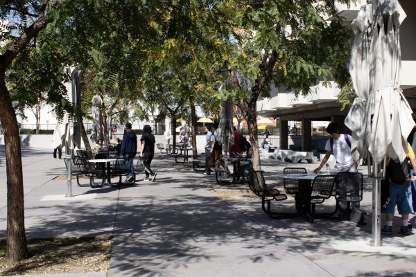 Tables and chairs on the west side of the library return after being used for the encampment last Spring. Photo by Jackson Tammariello.