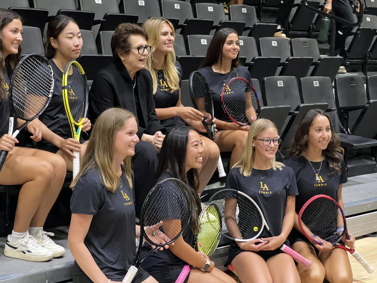 Billie Jean King sits with the Cal State LA women's tennis team during the statue unveiling ceremony on Oct. 2, 2024. 