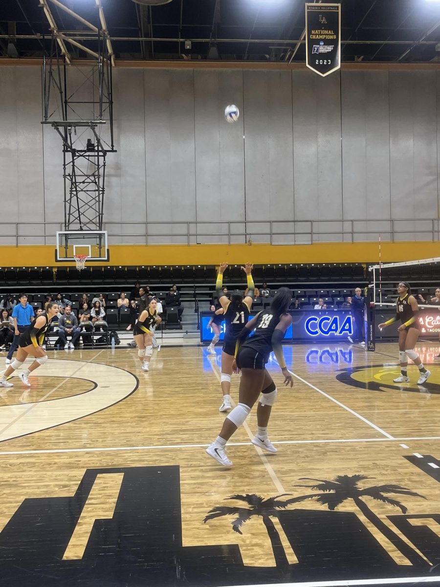 Arielle Chandler setting the ball for her teammates to respond