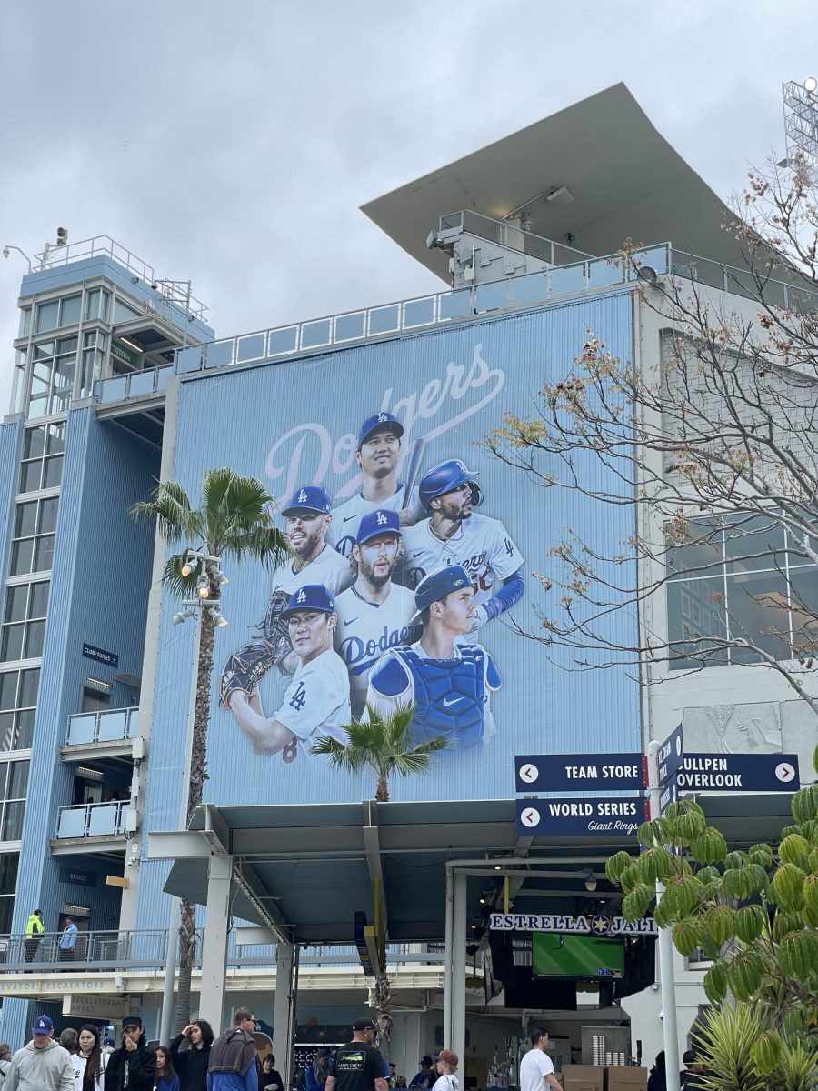 Dodger Stadium right-field mural showing Clayton Kershaw, Will Smith, Yoshinobu Yamamoto, Freddie Freeman, Mookie Betts, and Shohei Ohtani.