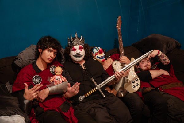 Tony Jupiter and band members Izzy and Jewels the Clown pose together, dressed in medieval costumes before taking the stage at the El Rey Theatre.