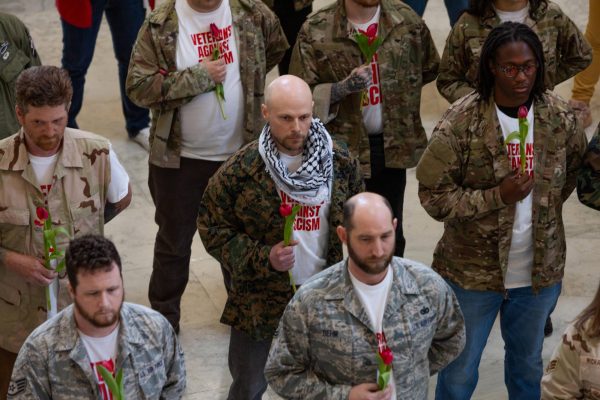 Tulips are deeply intertwined with Iranian culture and veterans of conscience held them to their chests to honor those martyred in the ongoing war against Iran. 
