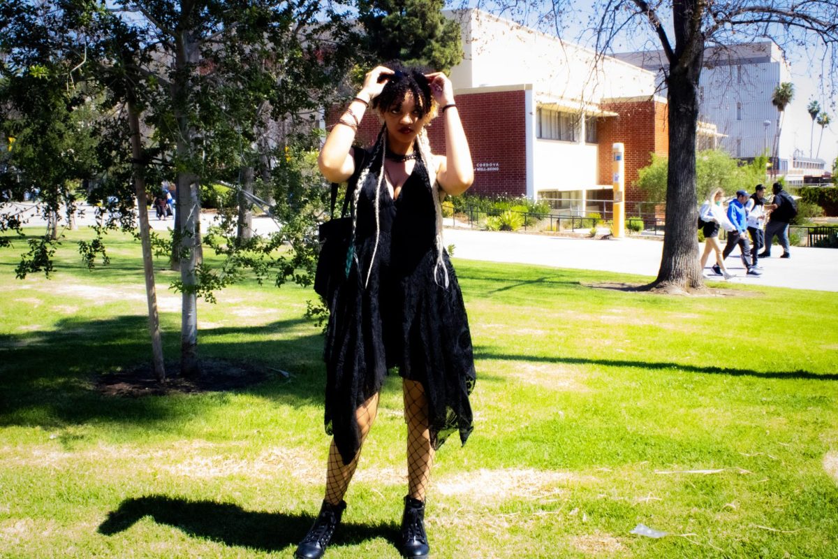Allanah Mouton showcases her outfit near the Janice Cordova Garden of Well-Being.