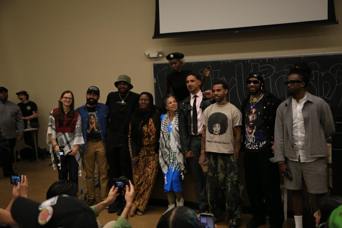 Panelists pose for photos during the Unity Uprising event, which was held on April 4 in honor of Dr. King and the wider liberation movement.