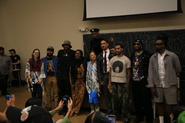 Panelists pose for photos during the Unity Uprising event, which was held on April 4 in honor of Dr. King and the wider liberation movement.