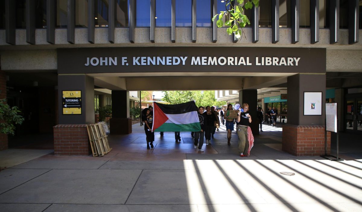Students march at Cal State LA in systemwide protest of OpenAI’s contract with the CSU on April 23.