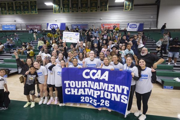 Cal State LA Women's Basketball holds a banner as the CCAA Tournament Champions following their win over Cal Poly Pomona.
Photo courtesy of Cal State LA Athletics